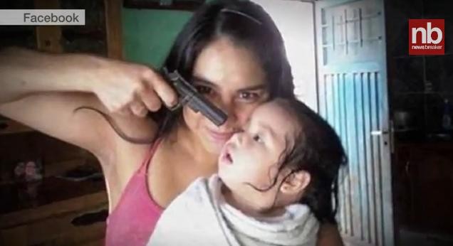 Name:  407464-facebook-photo-of-woman-with-gun-pointed-to-a-baby.JPG
Views: 1071
Size:  34.8 KB
