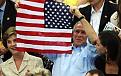 1283988183BushHoldsFlagBackwards.jpg